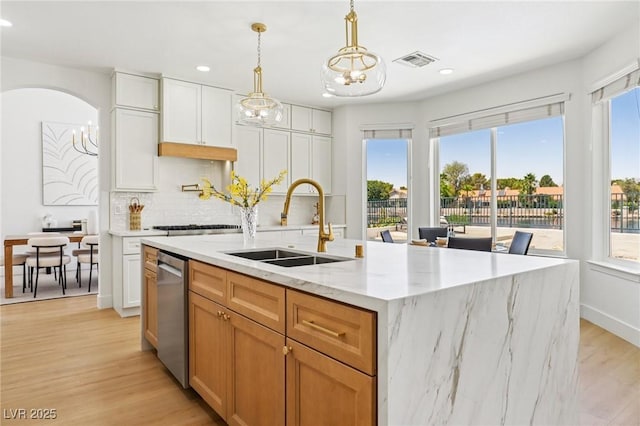 2469 Sun Reef Rd, Las Vegas, NV 89128 - kitchen with recessed lighting, light wood-type flooring, backsplash, dishwasher, and a center island with sink
