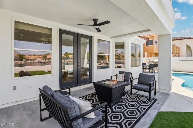 2469 Sun Reef Rd, Las Vegas, NV 89128 - view of patio / terrace featuring an outdoor living space with a fire pit, an outdoor pool, a ceiling fan, and french doors