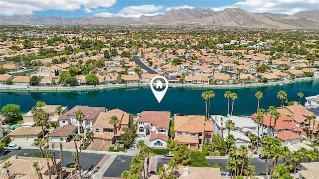 2469 Sun Reef Rd, Las Vegas, NV 89128 - aerial perspective of suburban area with a water and mountain view