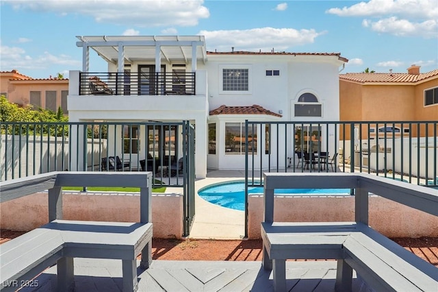 2469 Sun Reef Rd, Las Vegas, NV 89128 - back of house featuring a balcony, a patio, stucco siding, and a tiled roof