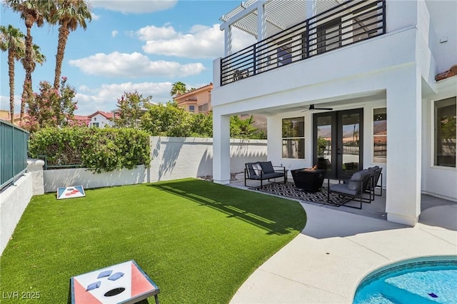 2469 Sun Reef Rd, Las Vegas, NV 89128 - view of yard featuring a balcony, a patio, ceiling fan, outdoor lounge area, and french doors
