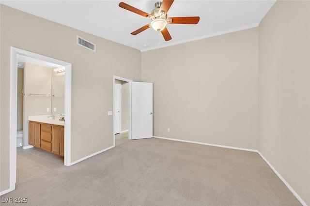 7920 Turtle Island Ct, Las Vegas, NV 89129 - unfurnished bedroom with light colored carpet, ensuite bathroom, and ceiling fan