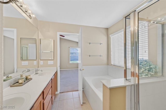 7920 Turtle Island Ct, Las Vegas, NV 89129 - bathroom featuring double vanity, a garden tub, tile patterned floors, and a shower stall