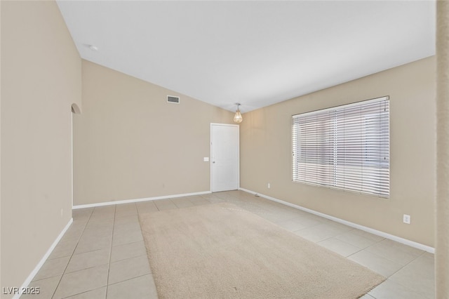 7920 Turtle Island Ct, Las Vegas, NV 89129 - unfurnished room with light tile patterned floors and lofted ceiling