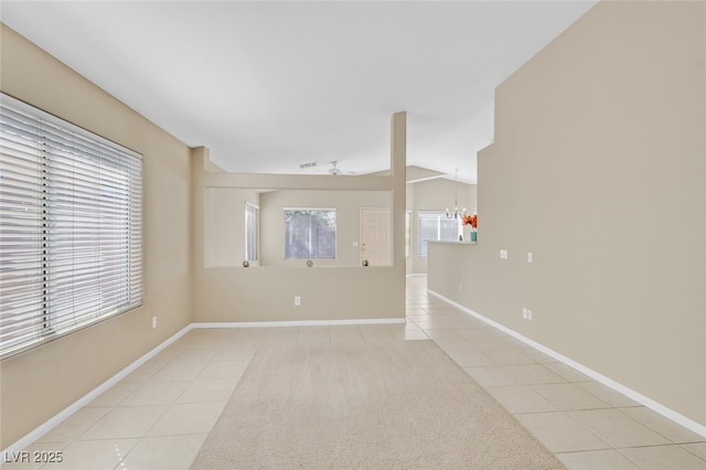 7920 Turtle Island Ct, Las Vegas, NV 89129 - spare room featuring light tile patterned floors, healthy amount of natural light, and a chandelier