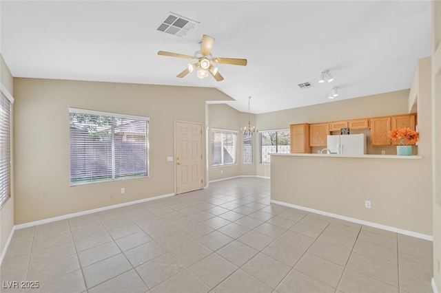 7920 Turtle Island Ct, Las Vegas, NV 89129 - unfurnished living room with a chandelier, light tile patterned floors, lofted ceiling, and ceiling fan
