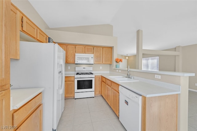 7920 Turtle Island Ct, Las Vegas, NV 89129 - kitchen featuring white appliances, light tile patterned floors, light brown cabinetry, a peninsula, and lofted ceiling