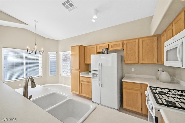 7920 Turtle Island Ct, Las Vegas, NV 89129 - kitchen with white appliances, a chandelier, light countertops, pendant lighting, and light brown cabinetry