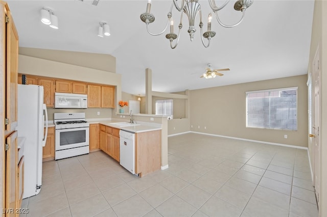 7920 Turtle Island Ct, Las Vegas, NV 89129 - kitchen with white appliances, a peninsula, light tile patterned floors, lofted ceiling, and open floor plan