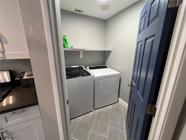 3736 Steinbeck Dr, Las Vegas, NV 89115 - washroom featuring separate washer and dryer and light tile patterned floors