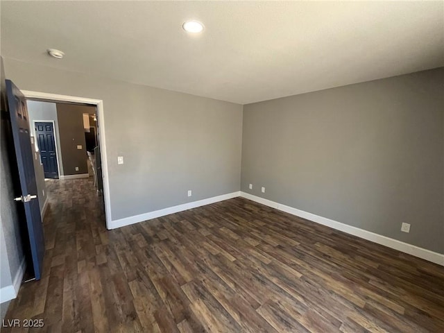 3736 Steinbeck Dr, Las Vegas, NV 89115 - spare room featuring dark wood-type flooring, recessed lighting, and a smoke detector