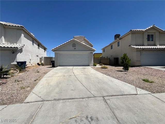 3736 Steinbeck Dr, Las Vegas, NV 89115 - view of front of house featuring a garage, stucco siding, and concrete driveway