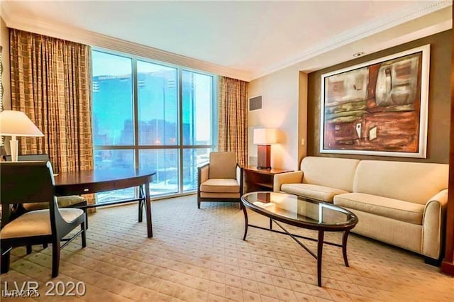135 E Harmon Ave Unit 1703, Las Vegas, NV 89109 - living area with crown molding, expansive windows, and light carpet