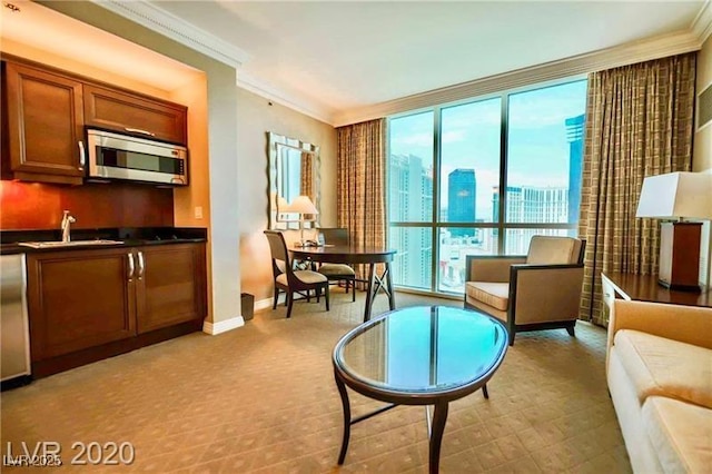 135 E Harmon Ave Unit 1703, Las Vegas, NV 89109 - living area with crown molding, a city view, and floor to ceiling windows