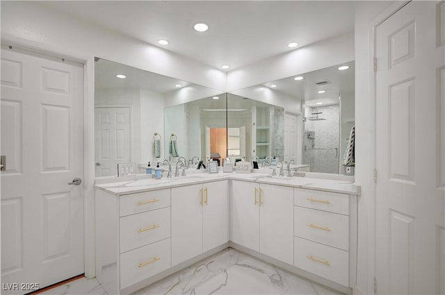 2851 Queens Courtyard Dr, Las Vegas, NV 89109 - bathroom with marble finish floors, double vanity, recessed lighting, and walk in shower