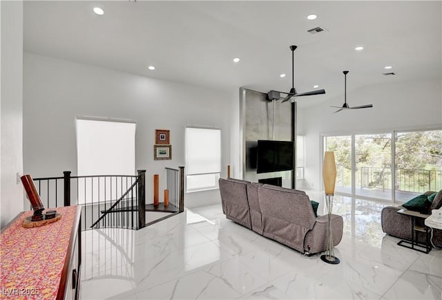 2851 Queens Courtyard Dr, Las Vegas, NV 89109 - living room with high vaulted ceiling, recessed lighting, light marble finish floors, and ceiling fan