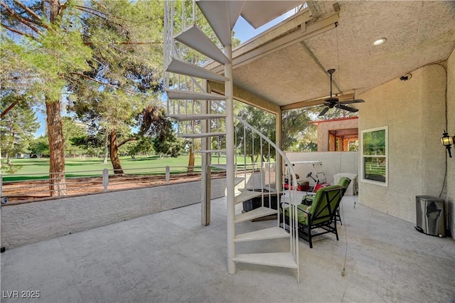 2851 Queens Courtyard Dr, Las Vegas, NV 89109 - view of patio featuring a ceiling fan and stairway
