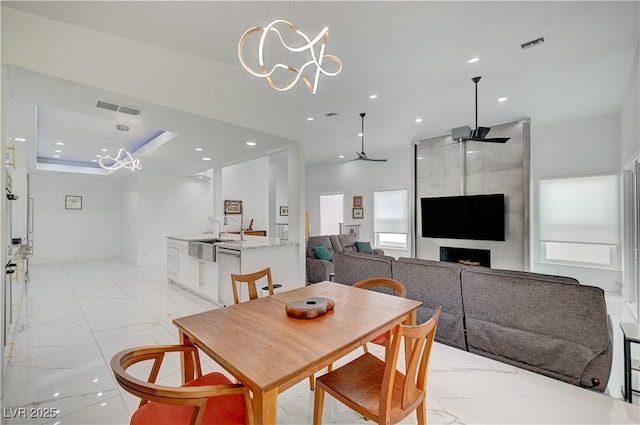 2851 Queens Courtyard Dr, Las Vegas, NV 89109 - dining space with a chandelier, light marble finish floors, recessed lighting, and ceiling fan