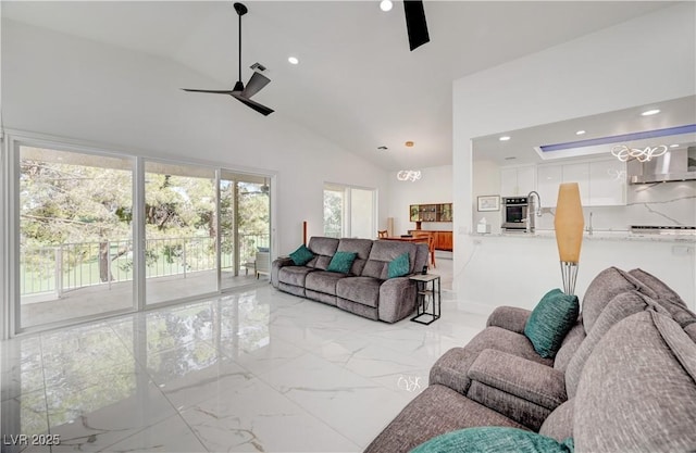 2851 Queens Courtyard Dr, Las Vegas, NV 89109 - living area with ceiling fan, recessed lighting, light marble finish floors, and high vaulted ceiling