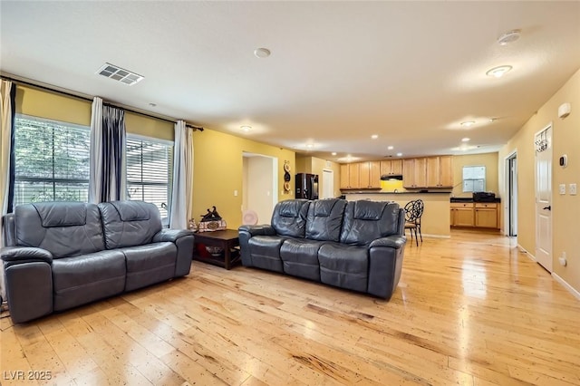 3168 Via Festiva, Henderson, NV 89044 - living room with light wood finished floors, healthy amount of natural light, and recessed lighting