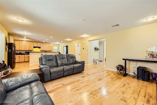 3168 Via Festiva, Henderson, NV 89044 - living room featuring light wood finished floors and recessed lighting