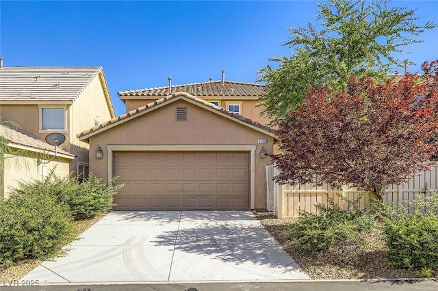3168 Via Festiva, Henderson, NV 89044 - view of front of house featuring a garage, concrete driveway, stucco siding, and a tiled roof