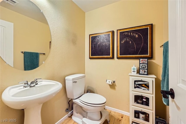 3168 Via Festiva, Henderson, NV 89044 - half bathroom with toilet and wood finished floors