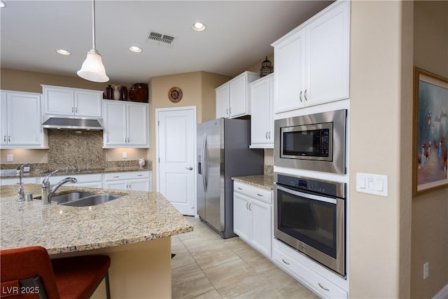 757 Bridle Path Ln, Mesquite, NV 89034 - kitchen featuring appliances with stainless steel finishes, under cabinet range hood, white cabinets, and recessed lighting