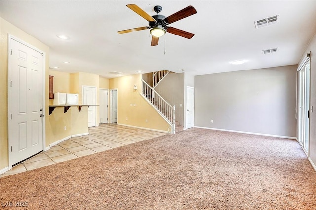 3905 Sweet Pine St Unit 102, Las Vegas, NV 89108 - unfurnished living room with stairway, a ceiling fan, light tile patterned floors, light colored carpet, and recessed lighting