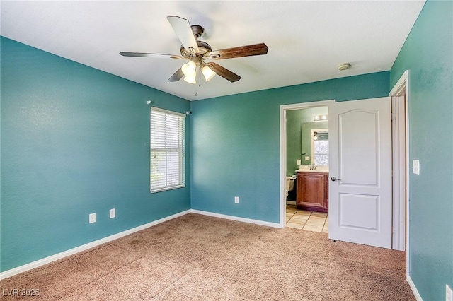 3905 Sweet Pine St Unit 102, Las Vegas, NV 89108 - unfurnished bedroom featuring light colored carpet, ensuite bath, and a ceiling fan