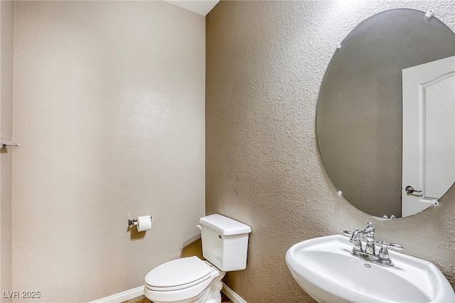 3905 Sweet Pine St Unit 102, Las Vegas, NV 89108 - half bathroom with a sink and toilet