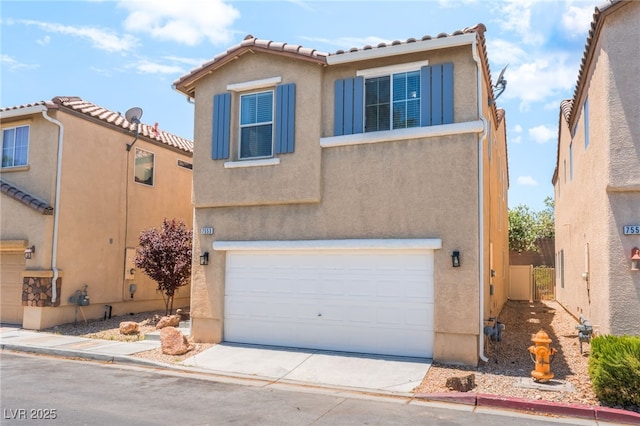 7553 Virginia Dale St, Las Vegas, NV 89131 - view of front of home featuring an attached garage, stucco siding, a tiled roof, and driveway