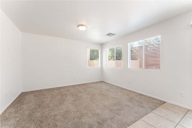 7553 Virginia Dale St, Las Vegas, NV 89131 - empty room with light carpet and light tile patterned floors