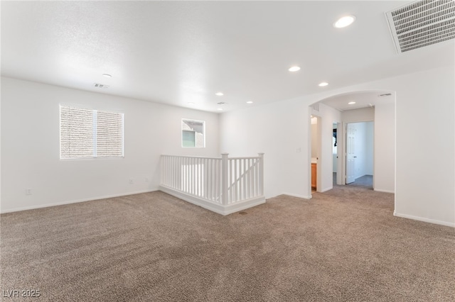 7553 Virginia Dale St, Las Vegas, NV 89131 - unfurnished room featuring arched walkways, light colored carpet, and recessed lighting
