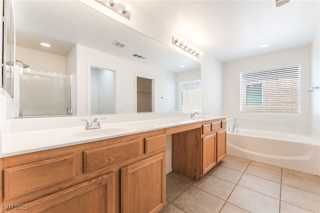 7553 Virginia Dale St, Las Vegas, NV 89131 - bathroom featuring double vanity, a bath, tile patterned floors, recessed lighting, and a shower