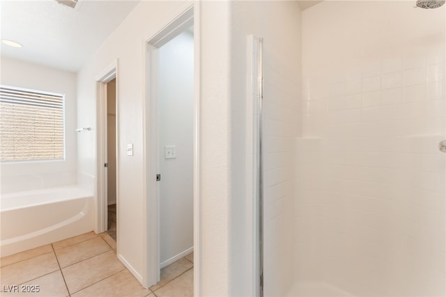 7553 Virginia Dale St, Las Vegas, NV 89131 - bathroom featuring a stall shower, a bath, and tile patterned floors