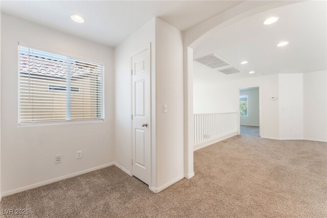 7553 Virginia Dale St, Las Vegas, NV 89131 - hall with light colored carpet, recessed lighting, and arched walkways