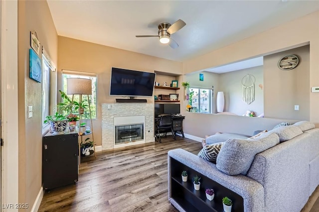 251 S Green Valley Pkwy Unit 3222, Henderson, NV 89012 - living area with a ceiling fan, wood finished floors, and a stone fireplace