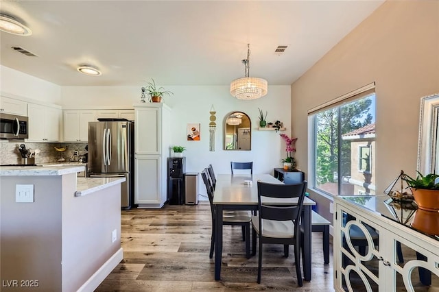 251 S Green Valley Pkwy Unit 3222, Henderson, NV 89012 - dining area with wood finished floors and baseboards