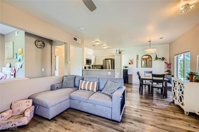 251 S Green Valley Pkwy Unit 3222, Henderson, NV 89012 - living room featuring light wood-style floors and ceiling fan