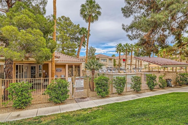 251 S Green Valley Pkwy Unit 3222, Henderson, NV 89012 - view of front of property with a fenced front yard, a tile roof, and stucco siding