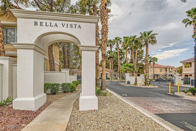 251 S Green Valley Pkwy Unit 3222, Henderson, NV 89012 - view of asphalt road featuring a gate, a gated entry, curbs, a residential view, and sidewalks