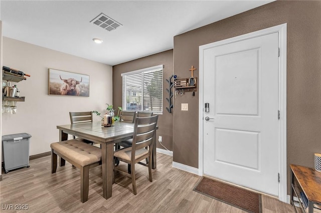 12280 Golden Wreath Rd Unit 3, Las Vegas, NV 89183 - dining area featuring light wood finished floors and baseboards