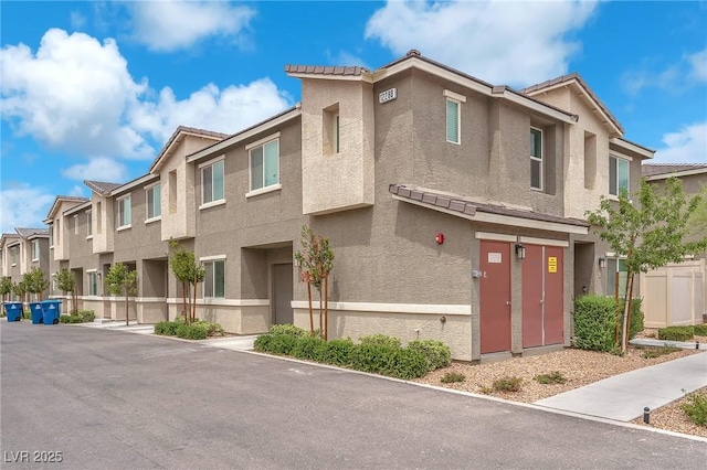 12280 Golden Wreath Rd Unit 3, Las Vegas, NV 89183 - multi unit property with stucco siding, a residential view, and a tile roof