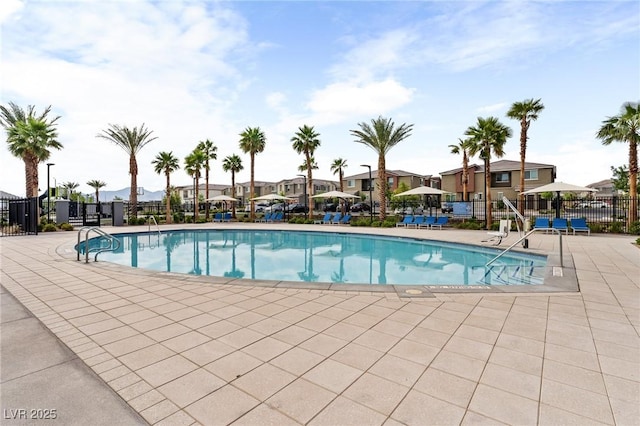12280 Golden Wreath Rd Unit 3, Las Vegas, NV 89183 - community pool with a residential view and a patio