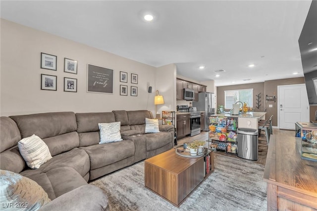 12280 Golden Wreath Rd Unit 3, Las Vegas, NV 89183 - living area with recessed lighting and light wood-style floors