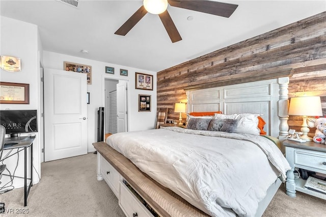 12280 Golden Wreath Rd Unit 3, Las Vegas, NV 89183 - bedroom featuring light colored carpet, wooden walls, and ceiling fan