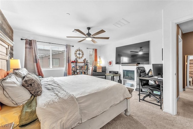 12280 Golden Wreath Rd Unit 3, Las Vegas, NV 89183 - bedroom with light colored carpet, an office area, and a ceiling fan