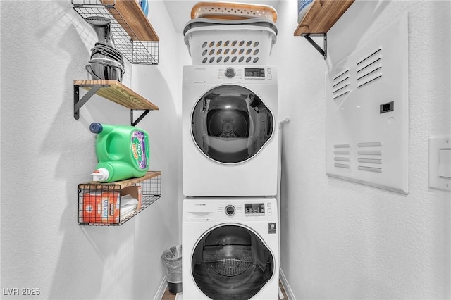 12280 Golden Wreath Rd Unit 3, Las Vegas, NV 89183 - washroom with stacked washer / dryer and baseboards
