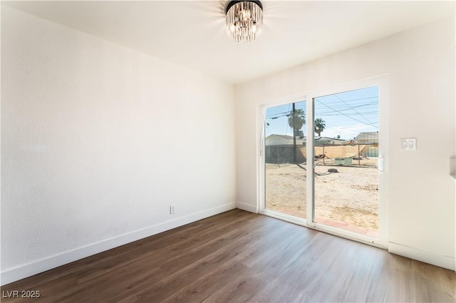 1648 J St, Las Vegas, NV 89106 - spare room with wood finished floors and a chandelier
